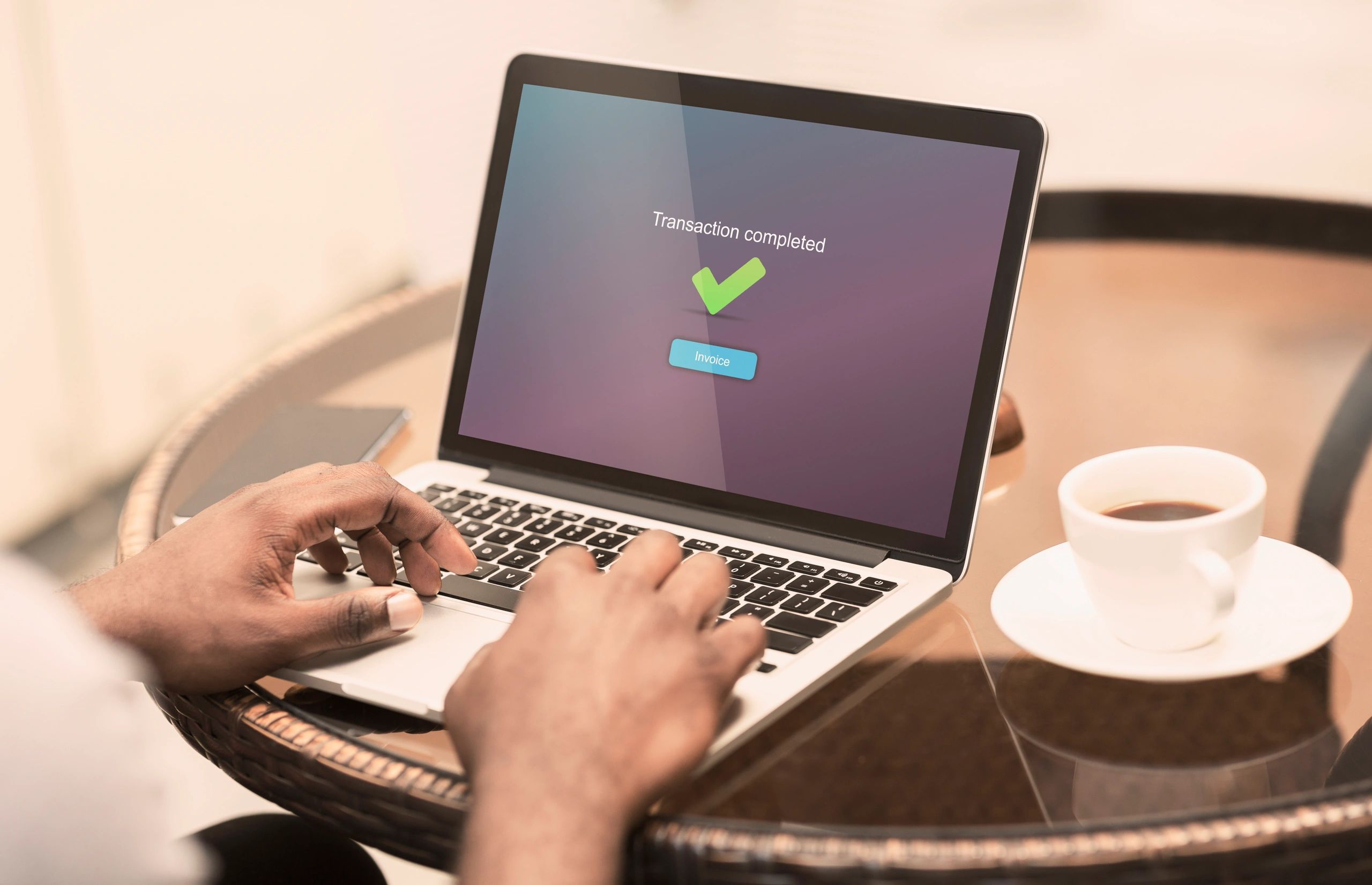 Person completing an online banking or checkout process on a laptop